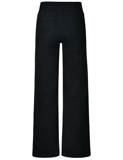 Stacked pair of Thalassa black wide-leg jeans, folded neatly to show the consistent black wash and quality.