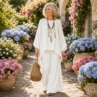 Lifestyle image of the Yara relaxed fit trousers worn in a travel setting.