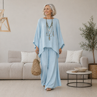 Model wearing the Yara light blue relaxed fit trousers, styled for a casual day out.