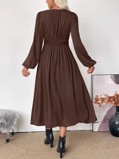Close-up detail of the smocked waist on the versatile brown midi dress, showing texture.