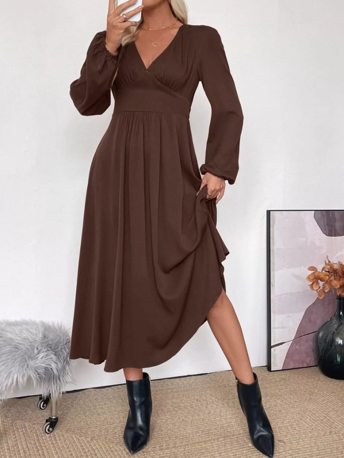 Model posing casually in the brown autumn staple midi dress, demonstrating its comfort and style.