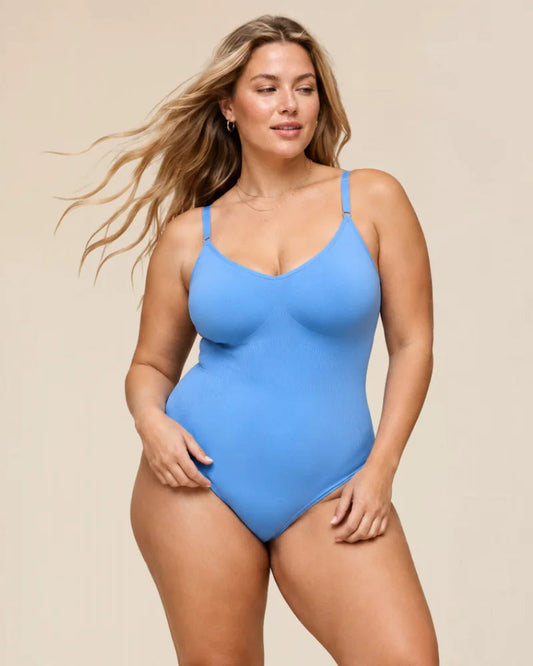 Front view of the black Zephyra sculpting body shaper on a mannequin, highlighting its seamless design.